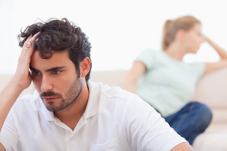 Couple mad at each other in their living room